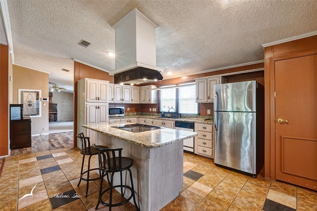 kitchen featuring sink, stainless steel appliances, a kitchen breakfast bar, island range hood, and a kitchen island