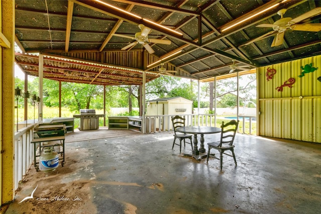 view of patio with a gazebo, area for grilling, ceiling fan, and a storage shed