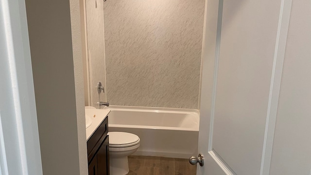 bathroom featuring wood-type flooring, toilet, and vanity