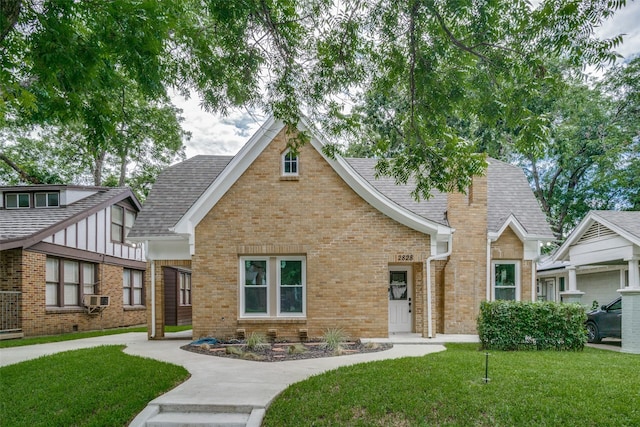 view of front of house with a front lawn and cooling unit