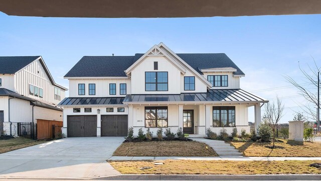 view of front facade with a garage and a front yard