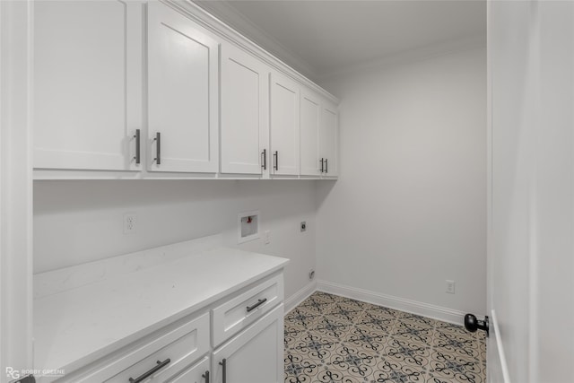 laundry area with cabinets, hookup for an electric dryer, hookup for a washing machine, light tile patterned flooring, and ornamental molding