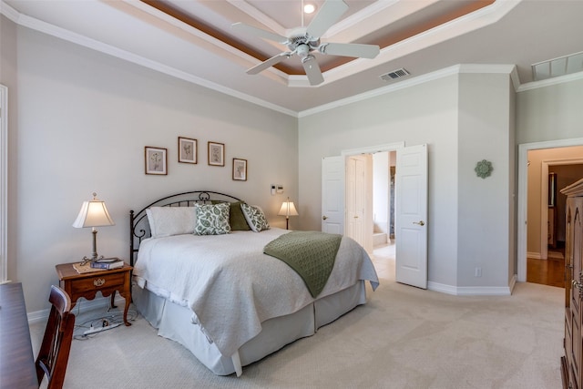 bedroom featuring ceiling fan, a raised ceiling, ornamental molding, and light carpet