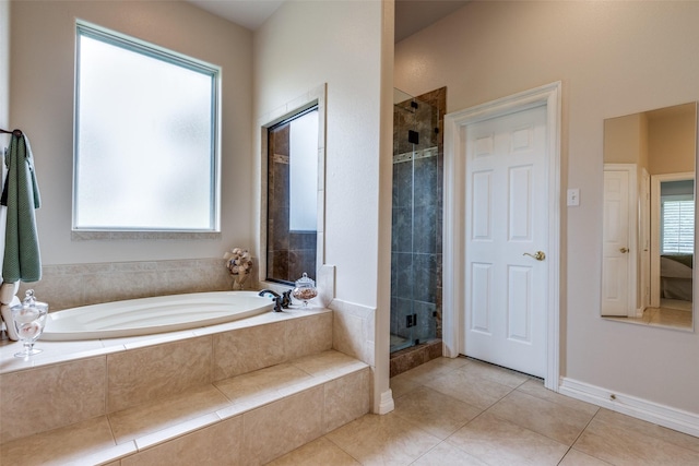 bathroom with tile patterned flooring and plus walk in shower