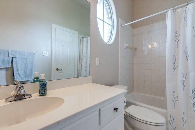 full bathroom featuring shower / bath combo with shower curtain, vanity, and toilet