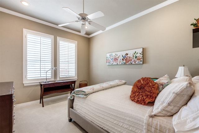 carpeted bedroom with multiple windows, ceiling fan, and crown molding