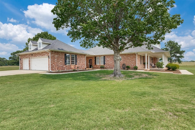 12198 Bell Rd, Pilot Point, TX 76258 - view of front of property featuring brick siding, a garage, a front yard, and driveway