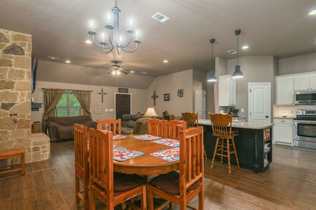 dining area featuring dark hardwood / wood-style floors, ceiling fan with notable chandelier, a textured ceiling, and lofted ceiling