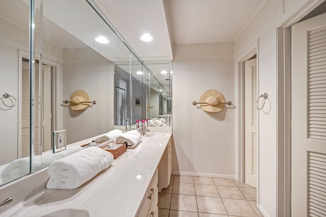 bathroom with tile patterned flooring and vanity