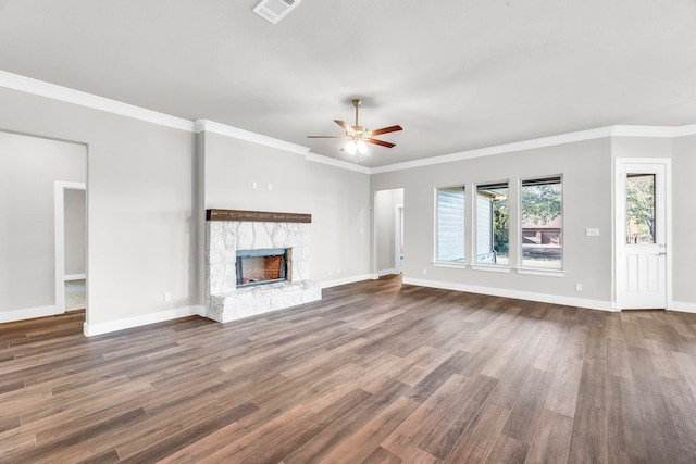 unfurnished living room with hardwood / wood-style floors, ceiling fan, and ornamental molding