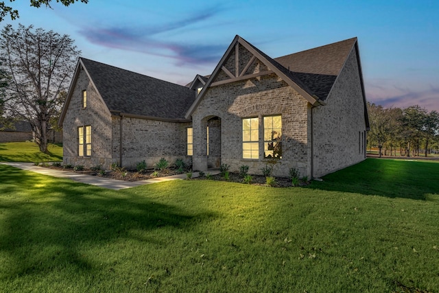 view of front of house with a lawn