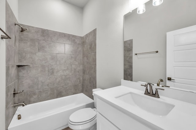 full bathroom featuring vanity, toilet, and tiled shower / bath