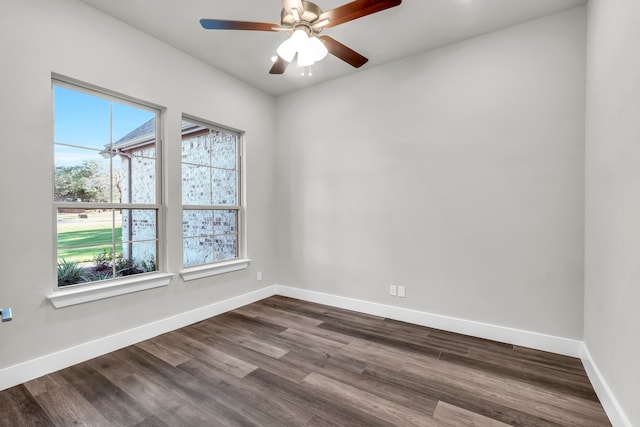 spare room with hardwood / wood-style floors and ceiling fan