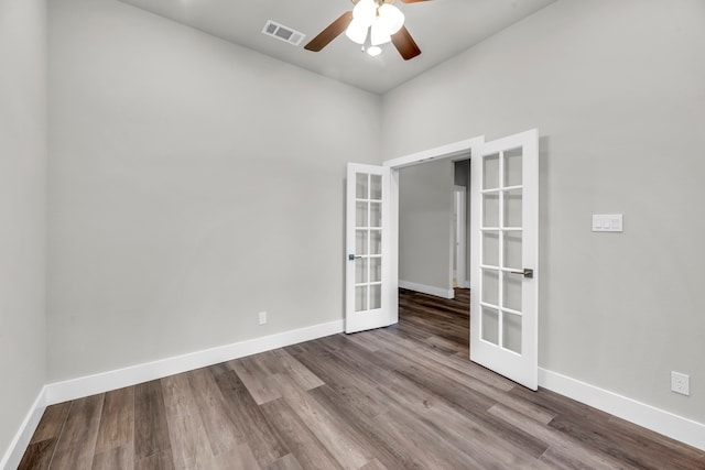 unfurnished room with hardwood / wood-style floors, ceiling fan, and french doors