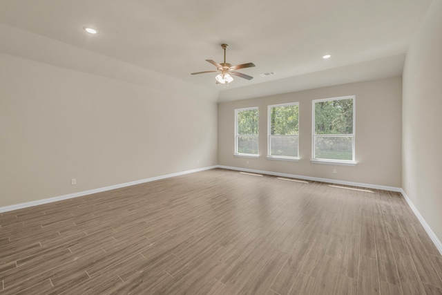 unfurnished room with ceiling fan and light hardwood / wood-style flooring