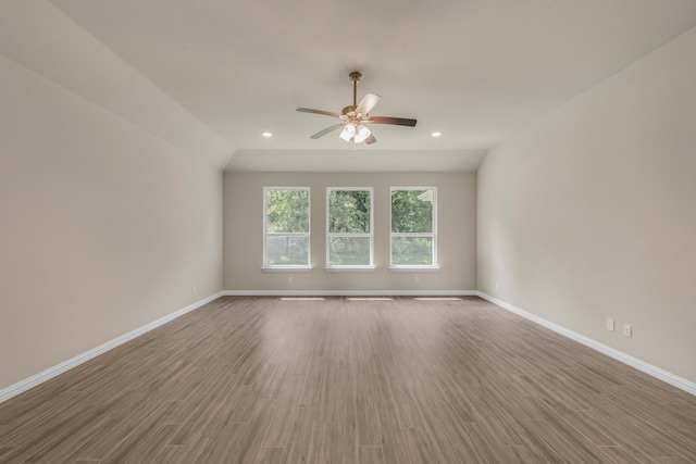 spare room featuring ceiling fan and hardwood / wood-style floors