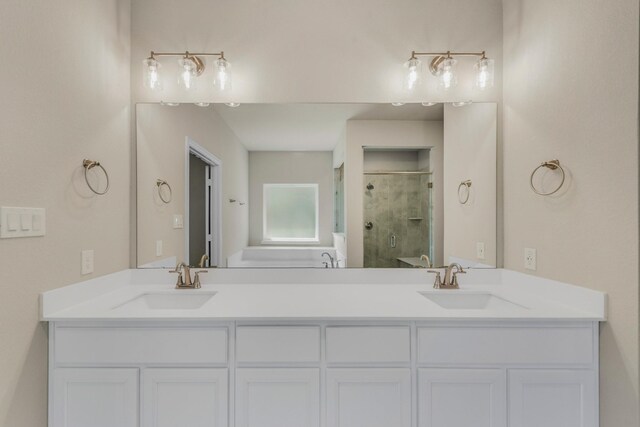 bathroom with a shower with door and vanity