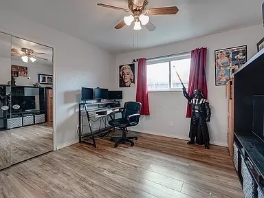 office area featuring ceiling fan and wood-type flooring