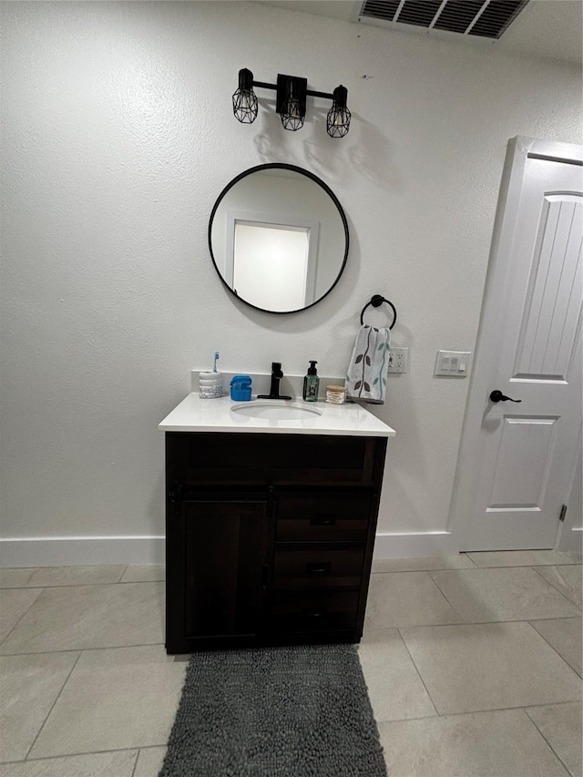 bathroom with tile patterned floors and vanity