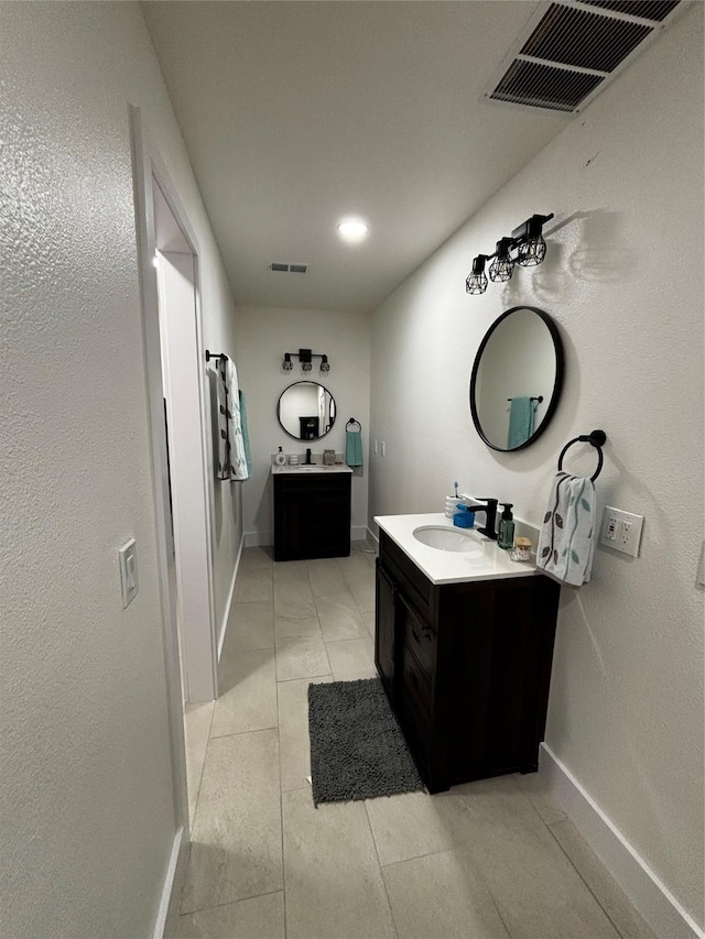 bathroom with vanity and tile patterned floors