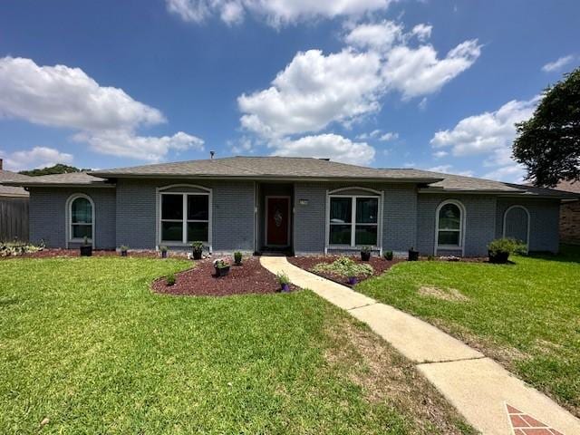 ranch-style house with a front yard