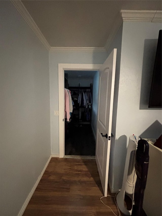 hallway featuring dark hardwood / wood-style flooring and ornamental molding