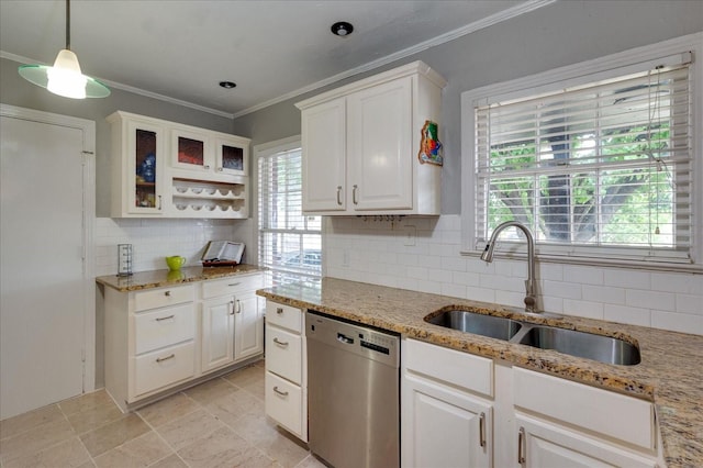 kitchen with tasteful backsplash, stainless steel dishwasher, sink, and white cabinets