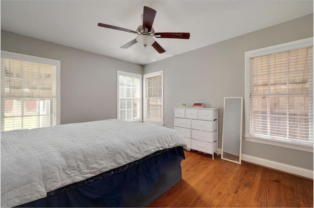 bedroom featuring hardwood / wood-style flooring and ceiling fan