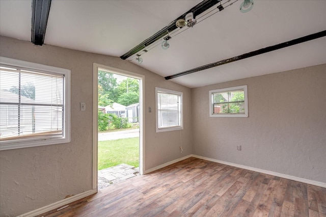 entryway featuring lofted ceiling with beams and hardwood / wood-style floors