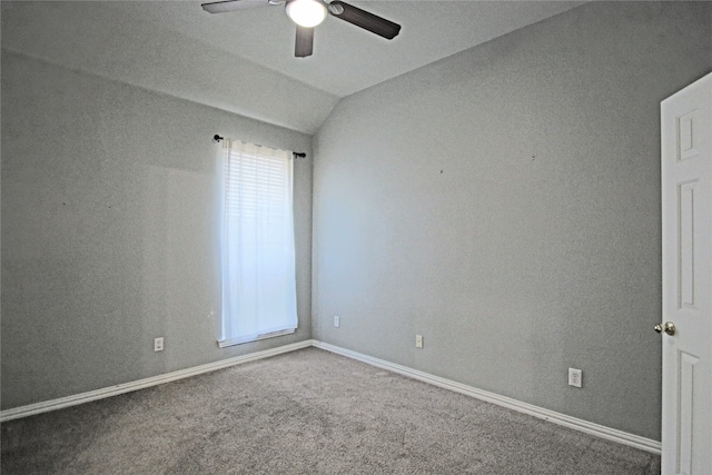 unfurnished room with ceiling fan, carpet floors, and vaulted ceiling