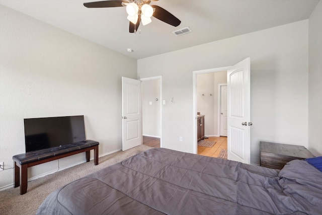 carpeted bedroom with ceiling fan