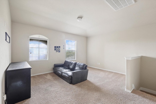 living area featuring light colored carpet