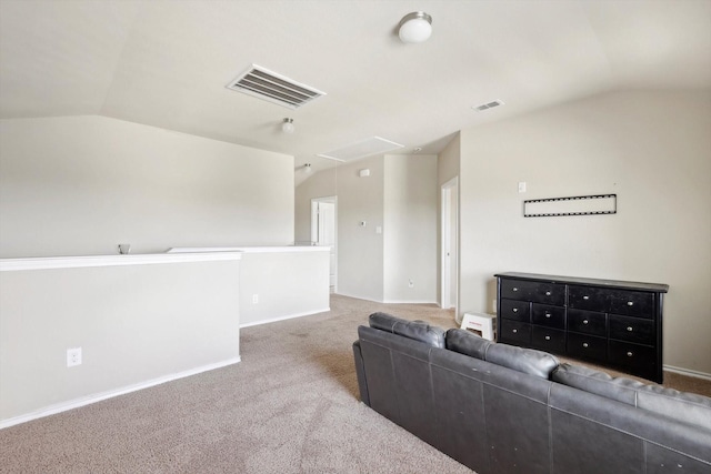 carpeted living room with vaulted ceiling