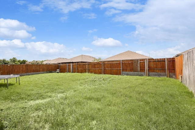 view of yard with a trampoline