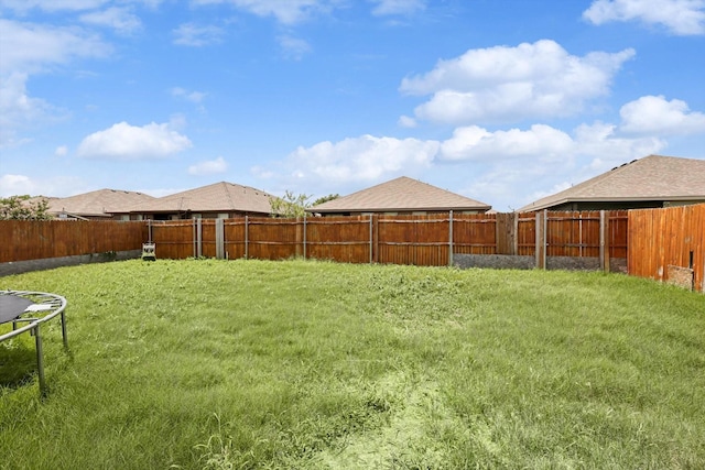 view of yard with a trampoline