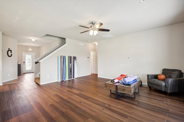 unfurnished living room with ceiling fan and dark hardwood / wood-style floors