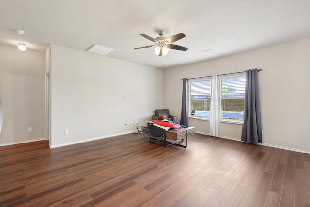 spare room featuring ceiling fan and dark hardwood / wood-style flooring