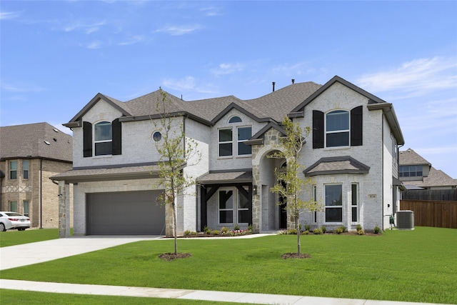 french provincial home featuring cooling unit, a garage, and a front yard