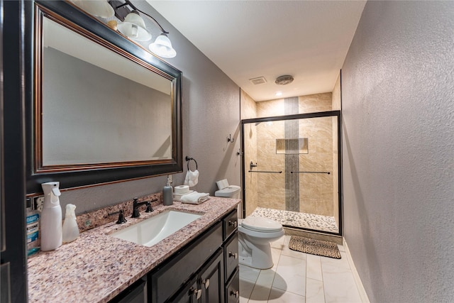 bathroom with toilet, tile patterned floors, a shower with shower door, and vanity