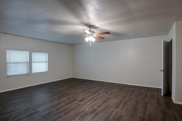 spare room with ceiling fan, dark hardwood / wood-style floors, and a textured ceiling