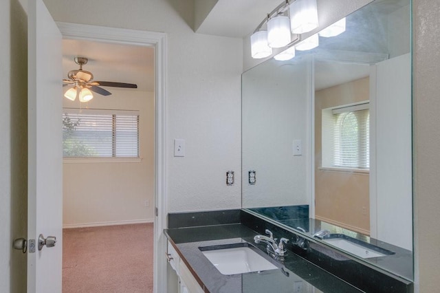 bathroom featuring ceiling fan and vanity