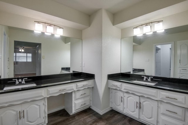 bathroom with ceiling fan, hardwood / wood-style floors, and vanity