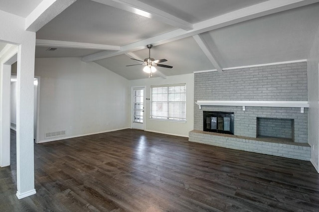 unfurnished living room featuring a fireplace, vaulted ceiling with beams, dark hardwood / wood-style floors, and ceiling fan