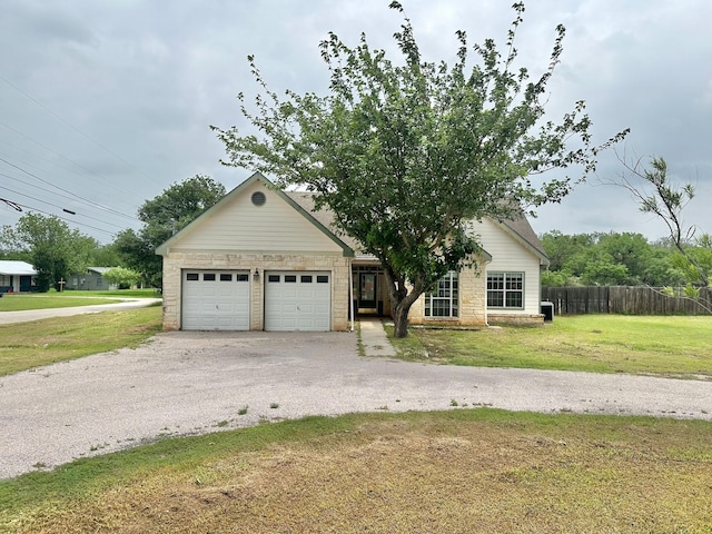 view of front of house featuring a garage and a front yard