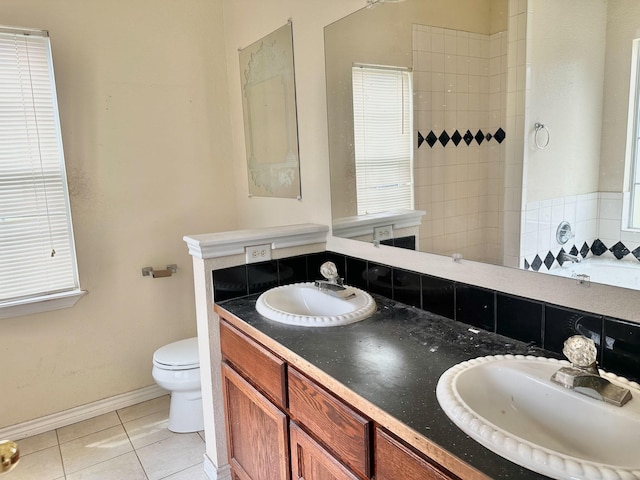 bathroom featuring vanity, tile patterned floors, and toilet