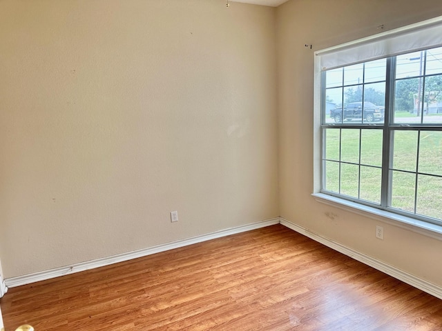 unfurnished room with light hardwood / wood-style flooring