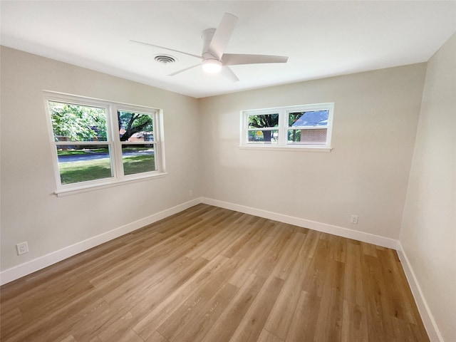 spare room featuring ceiling fan and light hardwood / wood-style floors