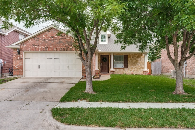 view of front facade featuring a garage and a front yard