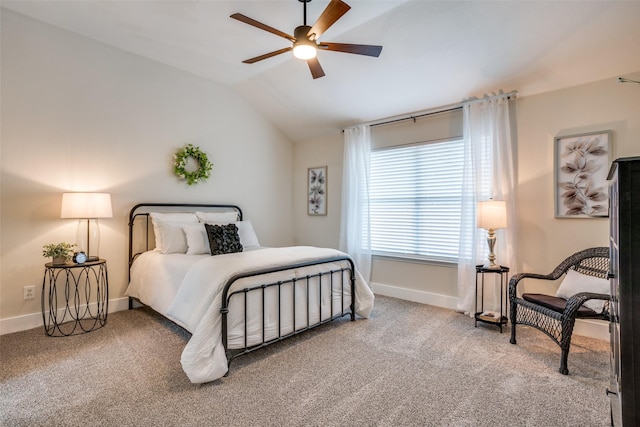 carpeted bedroom featuring lofted ceiling and ceiling fan