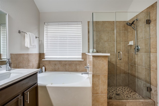 bathroom with vanity and plus walk in shower